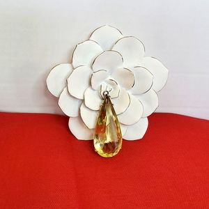 Large teardrop light yellow glass pendant.